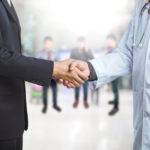 Businessman and doctor shaking hand's for some agreement